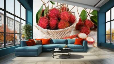 Fresh and ripe rambutan sweet tropical fruit on white background Wall mural