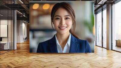 smiling business woman in professional setting exudes confidence and positivity. Her formal attire and warm expression create inviting atmosphere, perfect for corporate environment Wall mural