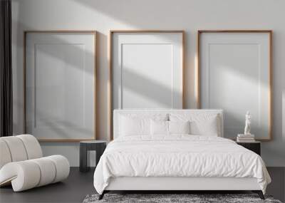 3 blank picture frames on the wall above a concrete console table, minimalist modern home interior Wall mural