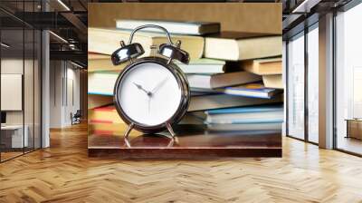 Alarm clock and books. Education concept Wall mural