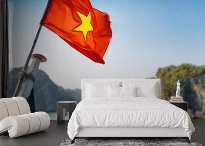 the flag of vietnam fluttering on ship in the ha long bay Wall mural