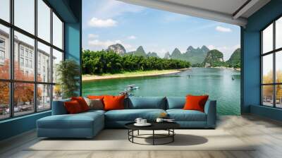 Tourist motorized rafts on the Li River with azure water Wall mural