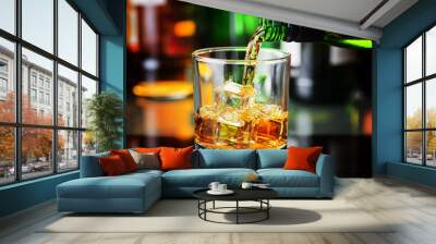 Whiskey pouring from a bottle into a glass in a bar Wall mural