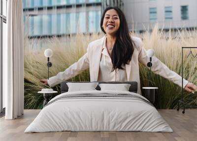 Portrait of happy young asian professional woman in the city - Business freedom and success Wall mural