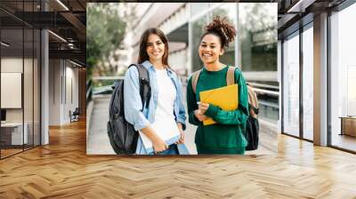 Two College Student female friends smiling ready for classes at the University campus Wall mural