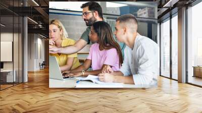 Young teacher helping teenager students at College, learning technology and science in preparatory course for university Wall mural