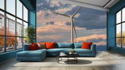 Wind turbine against a background of cloudy sky Wall mural