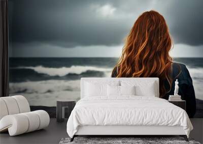 redhead woman is thinking on the beach Wall mural