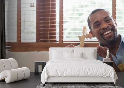 african american father playing airplane toys with his little boy. banner and panoramic web with cop Wall mural