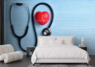 Red heart with stethoscope. Wall mural