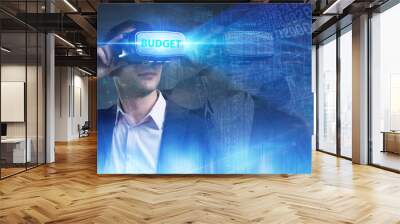 Business, Technology, Internet and network concept. Young businessman working in virtual reality glasses sees the inscription: Budget Wall mural