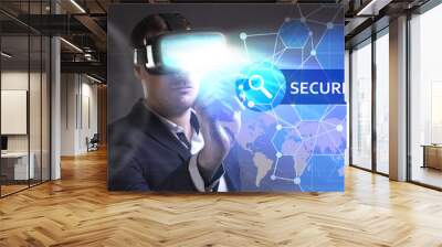 Business, Technology, Internet and network concept. Young businessman working in virtual reality glasses sees the inscription: Security Wall mural