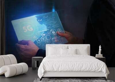 Business, Technology, Internet and network concept. Young businessman working on a virtual screen of the future and sees the inscription: 5G Wall mural