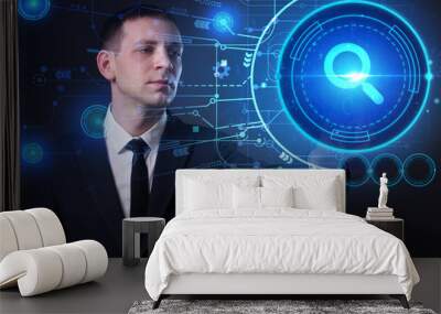 Business, Technology, Internet and network concept. Young businessman working on a virtual screen of the future and sees the inscription: Wall mural