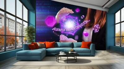 Business, Technology, Internet and network concept. Young businessman working on a virtual screen of the future and sees the inscription: Business transformation Wall mural