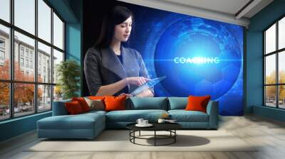 Business, Technology, Internet and network concept. Young businessman working on a virtual screen of the future and sees the inscription: Coaching Wall mural