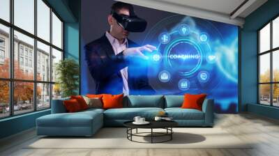 Business, Technology, Internet and network concept. Young businessman working on a virtual screen of the future and sees the inscription: Coaching Wall mural