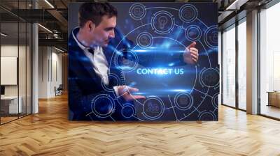 Business, Technology, Internet and network concept. Young businessman working on a virtual screen of the future and sees the inscription: Contact us Wall mural