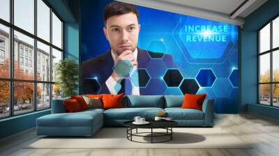 Business, Technology, Internet and network concept. Young businessman working on a virtual screen of the future and sees the inscription: Increase revenue Wall mural