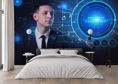 Business, Technology, Internet and network concept. Young businessman working on a virtual screen of the future and sees the inscription: Property management Wall mural