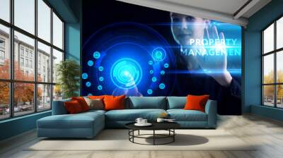 Business, Technology, Internet and network concept. Young businessman working on a virtual screen of the future and sees the inscription: Property management Wall mural