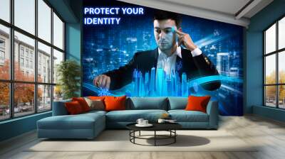 Business, Technology, Internet and network concept. Young businessman working on a virtual screen of the future and sees the inscription: Protect your identity Wall mural