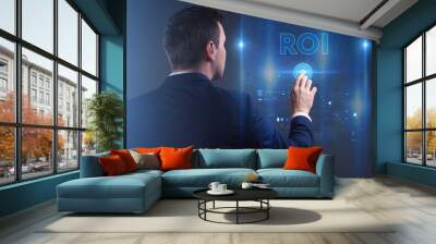 Business, Technology, Internet and network concept. Young businessman working on a virtual screen of the future and sees the inscription: ROI Wall mural