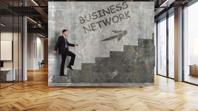 Business, technology, internet and networking concept. A young entrepreneur goes up the career ladder: business network Wall mural