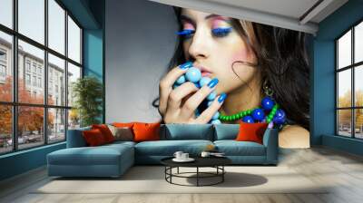 Beautiful girl with bright beads Wall mural