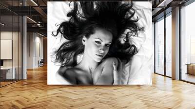 Young woman with magnificent scattered hair Wall mural