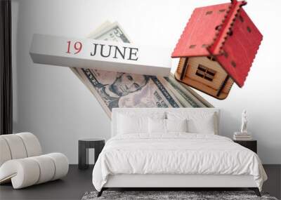 Money, home and calendar. The concept of financial independence and the scheduled start date for June 19 Wall mural