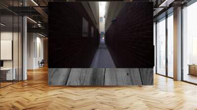 narrow passage between two tall houses Wall mural