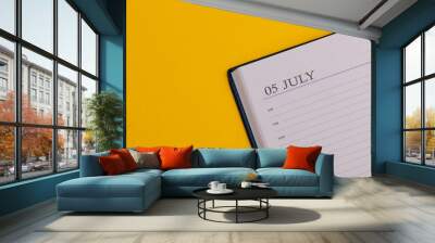 Notepad or diary with the exact date on a yellow background. Calendar for July 5 - summer time. Space for text. Wall mural