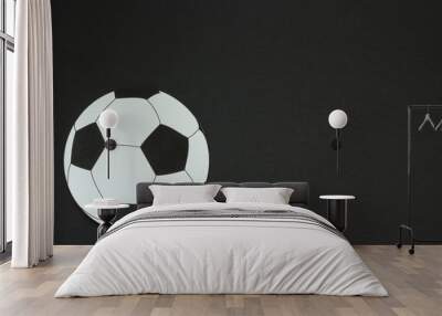 old soccer ball isolated on black background Wall mural