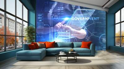 The concept of business, technology, the Internet and the network. A young entrepreneur working on a virtual screen of the future and sees the inscription: Government Wall mural