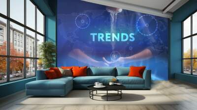 The concept of business, technology, the Internet and the network. A young entrepreneur working on a virtual screen of the future and sees the inscription: Trends Wall mural