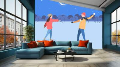 A couple playing snowballs fight. Young people man and woman in winter clothes having fun playing in the snow outdoors. Vector illustration of flat design Wall mural