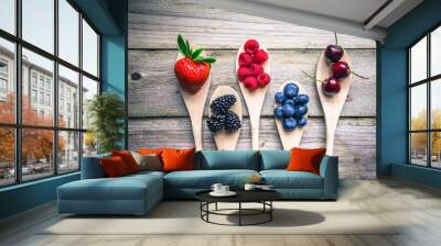 Berries on wooden rustic background Wall mural