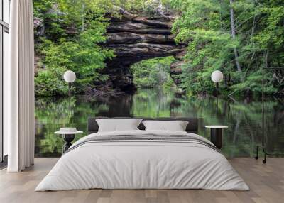 Kayaking the Natural Arch in Pickett State Park in Jamestown, Tennessee. This popular state park allows visitors to rent kayaks and view the the natural bridge up close.  Wall mural