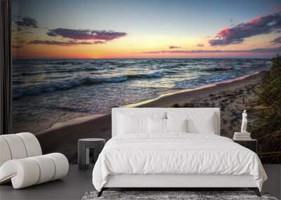 Summer Beach Sunset Panorama. The sunset over a wide sand Lake Michigan beach on the Great Lakes Coast. Muskegon, Michigan. Wall mural