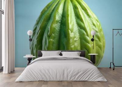 A vibrant green fig. captured in a close up shot. showcasing its detailed texture and natural beauty. Wall mural