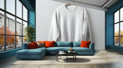 Blank white sweatshirt mockup hanging on a wooden hanger. isolated on white background. Wall mural