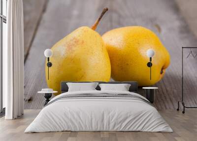 Fresh ripe organic yello pears on rustic wooden table, natural background, diet food. Wall mural