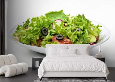 Delicious fresh salad dish on a white plate, isolated on white background. Healthy eating scene, fresh lettuce, tomatoes, cucumber and olives in a bowl. Wall mural