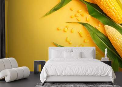 A fresh corn on the cob with vibrant green leaves set against a bright yellow background, showcasing the natural beauty of produce, banner with copy space Wall mural