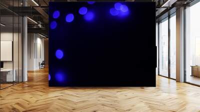 Background of blue bokeh (led strip light in a 50mm lens) on a dark black background.  Design elements Wall mural