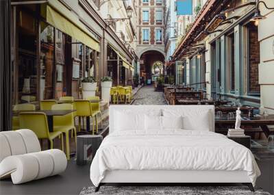 Cozy street near Boulevard San-German with tables of cafe and pub  in Paris, France Wall mural