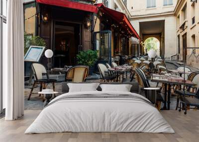 Cozy street near Boulevard San-German with tables of cafe  in Paris, France. Cityscape of Paris. Architecture and landmarks of Paris Wall mural