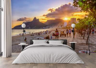 Sunset view of Ipanema beach with mosaic of sidewalk, Leblon beach and the Mountain Dois Irmao in Rio de Janeiro. Brazil Wall mural