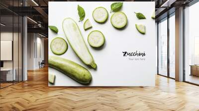 Creative layout of solid and sliced zucchini on white background with space for text. Isolated vegetables on white background. View from above Wall mural